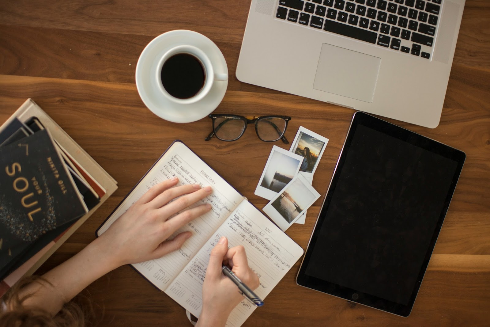 A woman writing in her journal. 