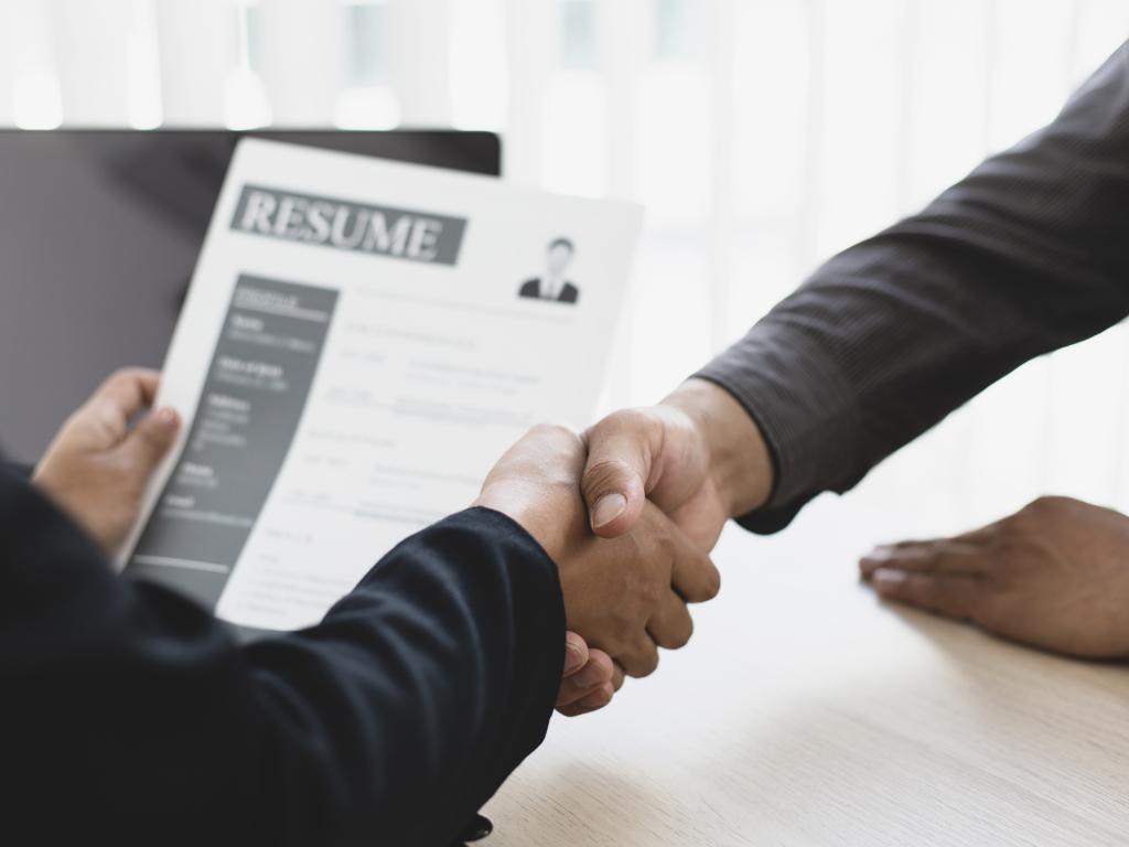 Interviewer and interviewee shaking hands