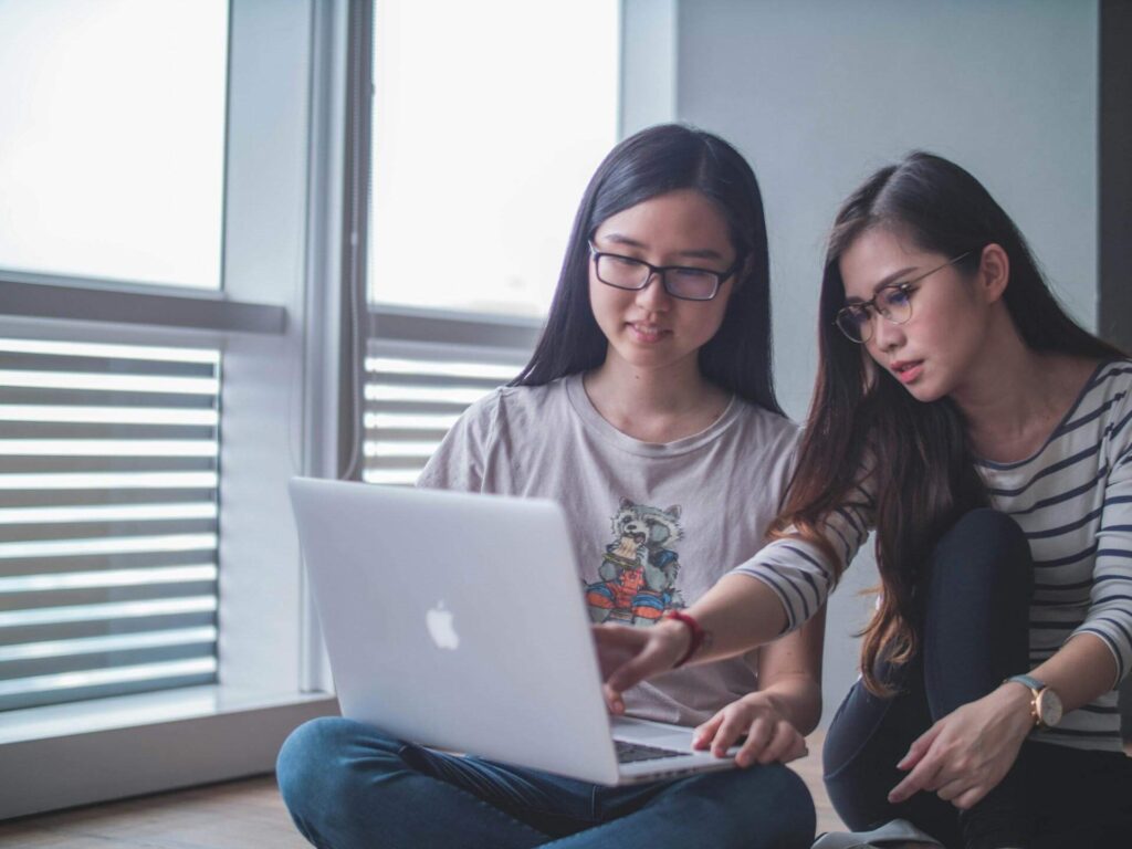 Two students working on an academic assignment