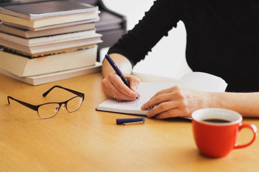 A girl writing an article. 