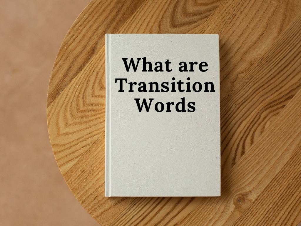 A book about what are transition words placed on a wooden table