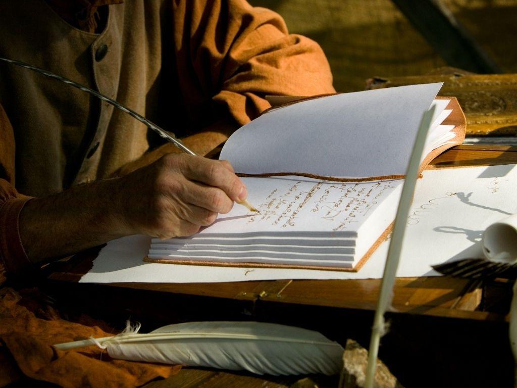 a person writing a book with his pen comfortably sitting and wondering How Long Does It Take To Write A Book