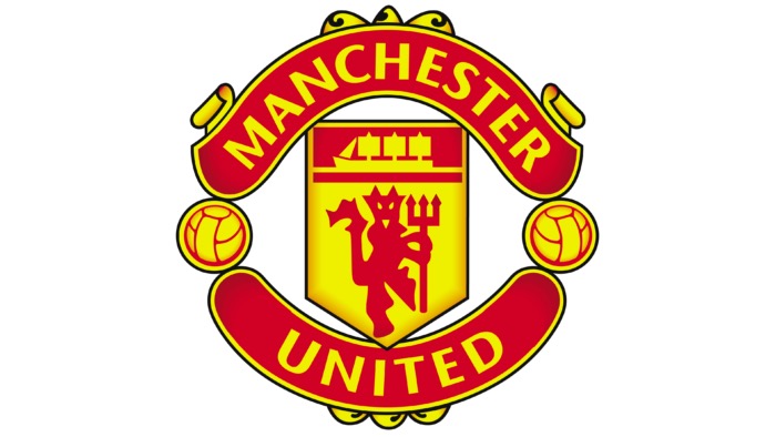 Manchester United crest featuring a red devil with a trident and a ship in full sail, framed by footballs and banners.