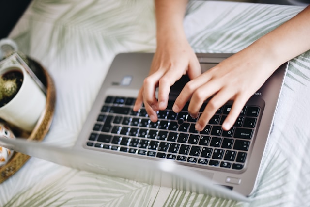 A person typing on a computer