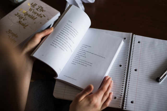 A person reading a book of poems