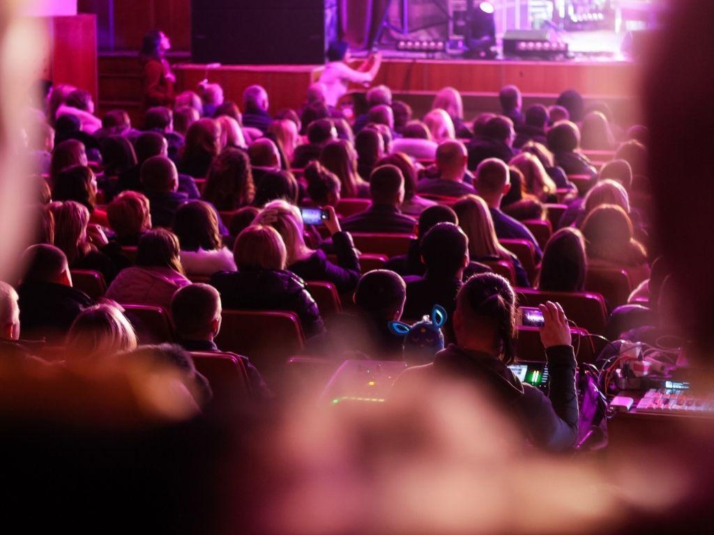 an audience watching a play in a theater