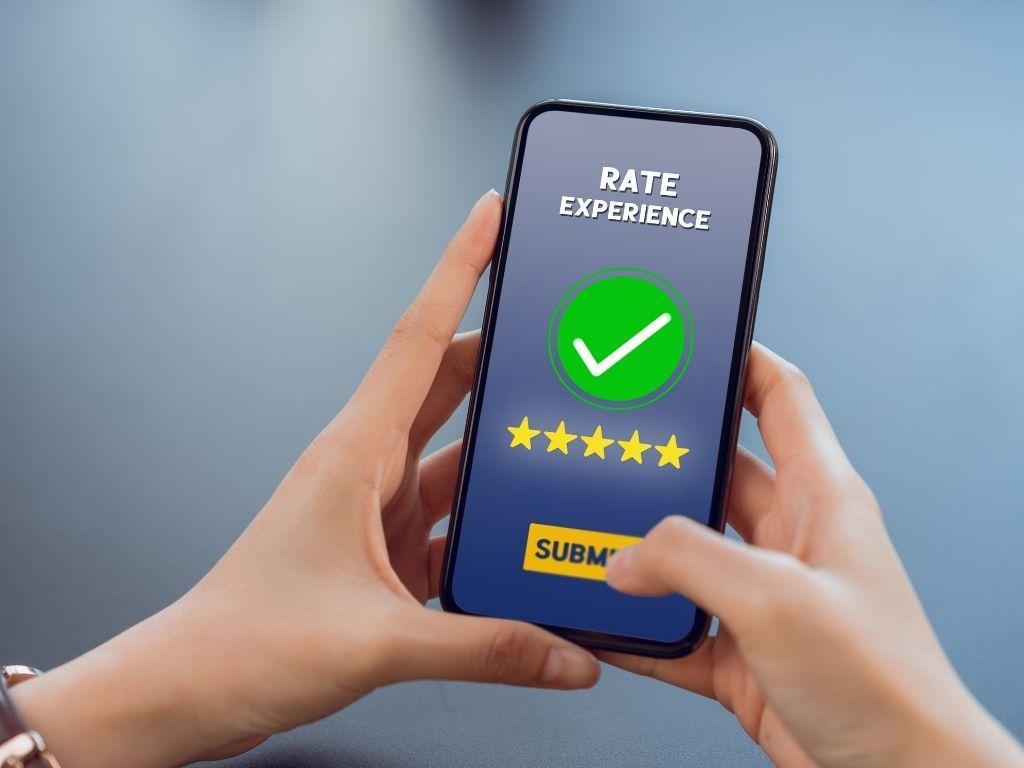 A person giving 5 stars rating on a service experience