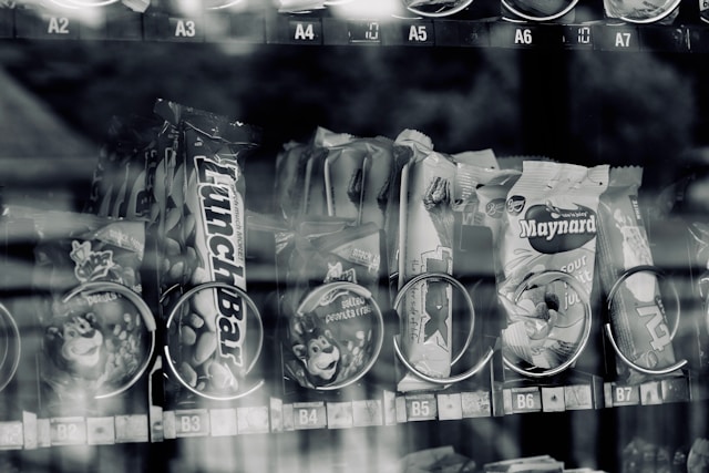 Confectionary inside a vending machine black and white scale