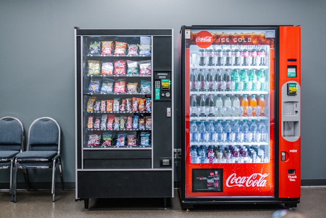 Two vending machines against a wall