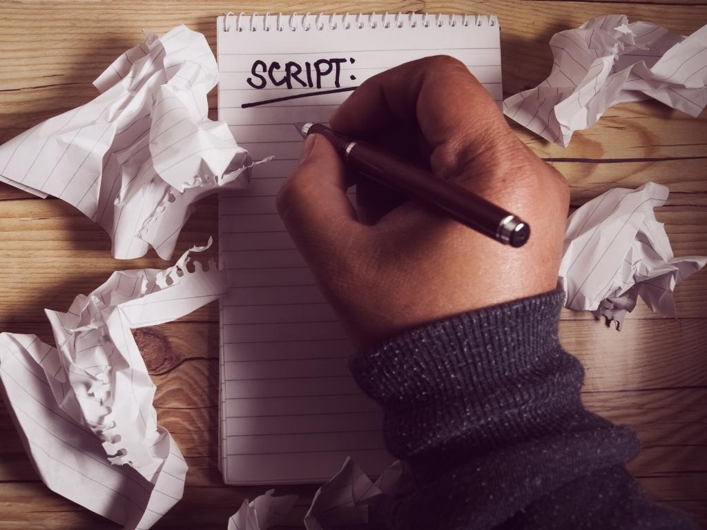 a person practicing on how to write a script